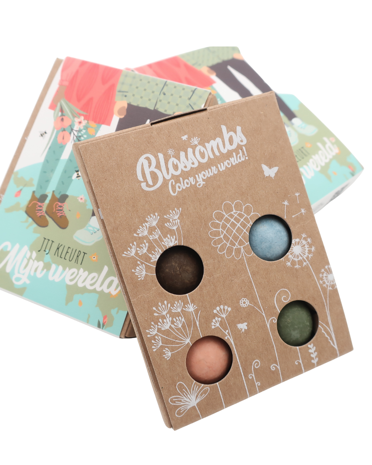 Vier biologische zaadbommetjes in een compacte cadeauverpakking, klaar om uit te groeien tot een kleurrijk bloemenveld dat bijen en vlinders aantrekt.